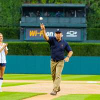 Man throwing pitch next to Detroit Tigers mascot pt. 3